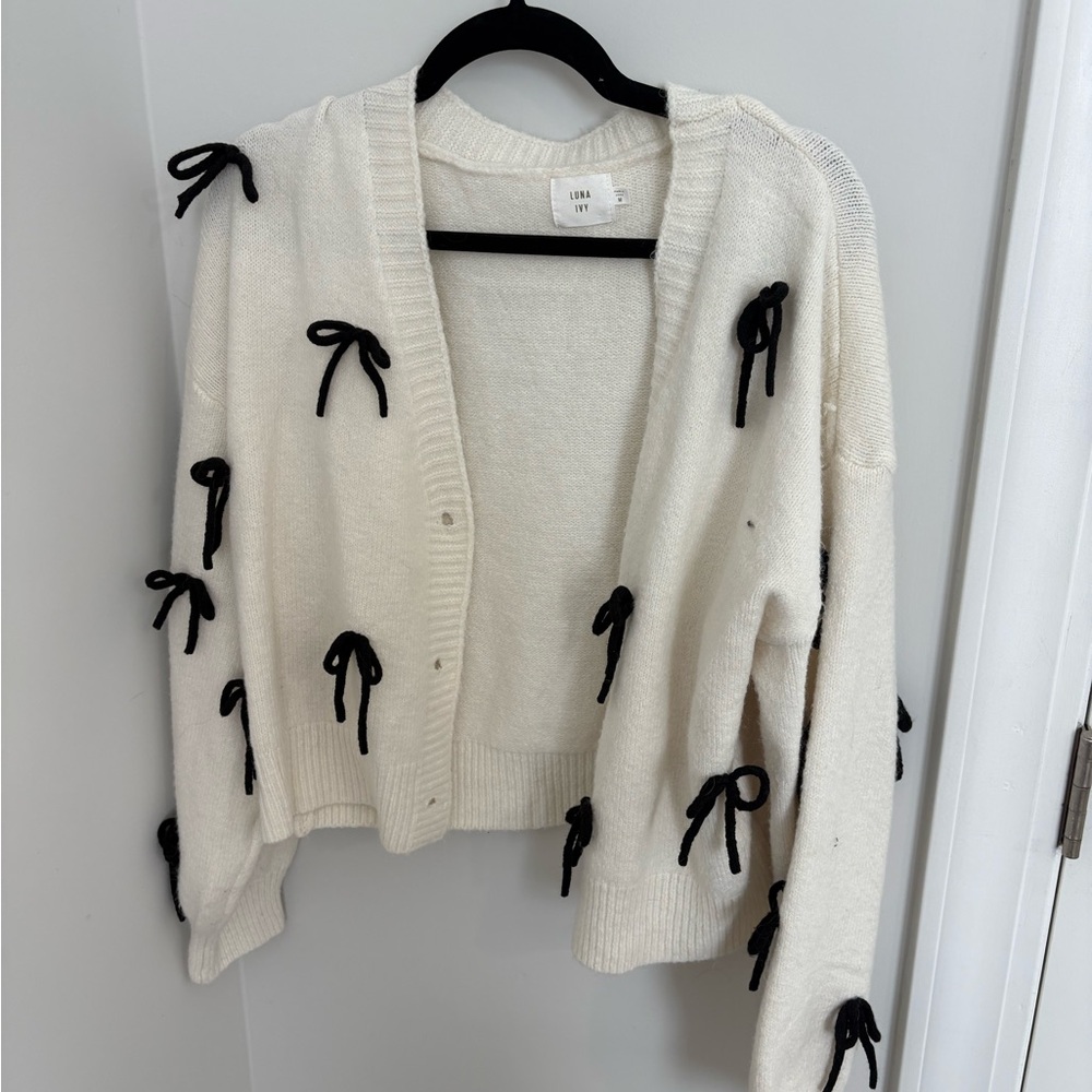 Chic Ivory Cardigan with Black Bow Details